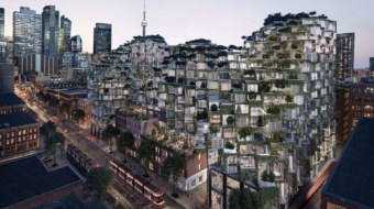 Rendering of KING Toronto's four stepped glass-block peaks on King Street West at dusk, with the CN Tower behind